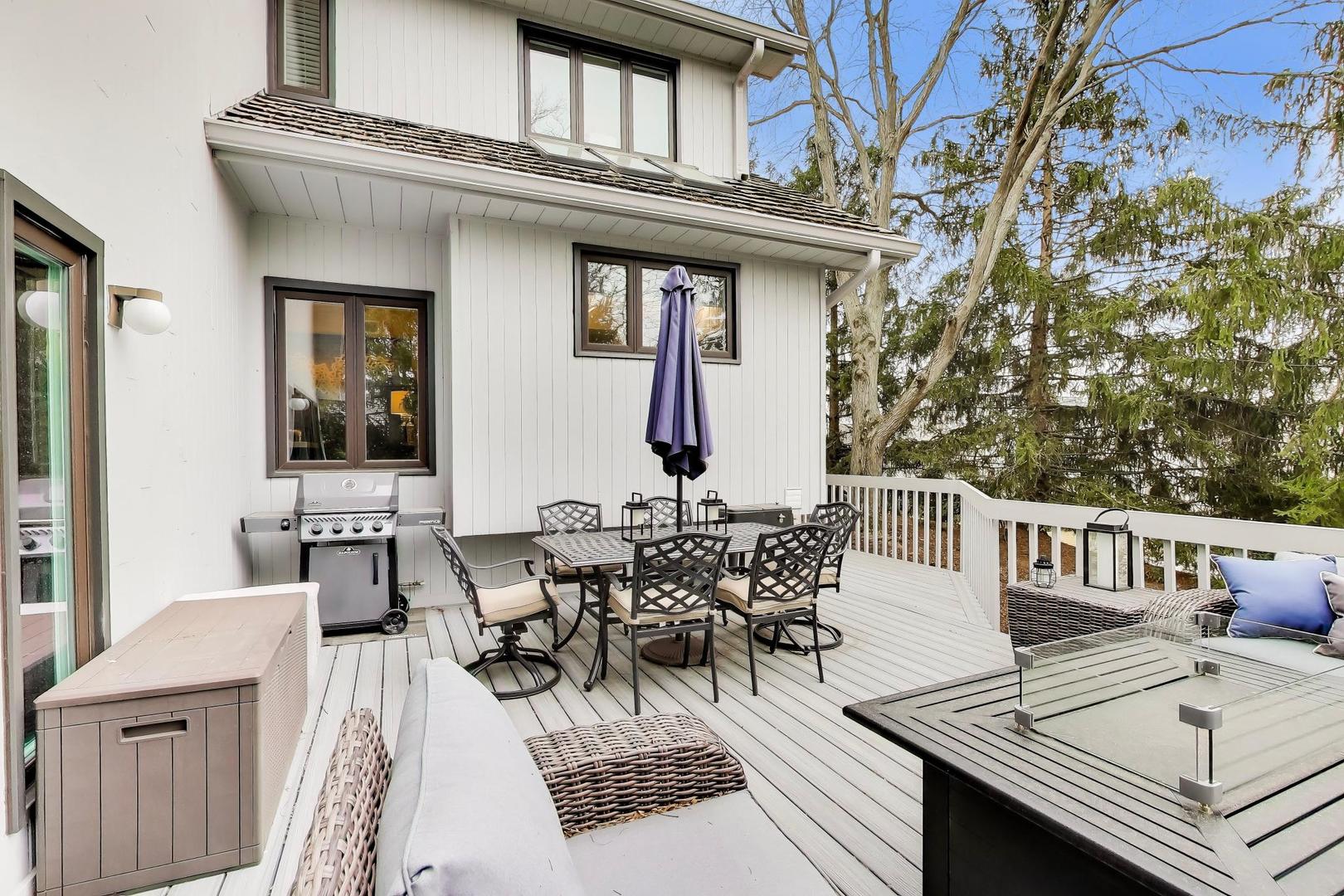 22 Rodeo Drive Burr Ridge, IL 60527 - Photo 37 of 46 a view of a patio with table and chairs with wooden floor and fence
