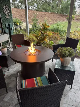 a view of a balcony with furniture and a potted plant