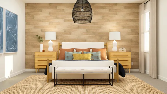 a bedroom with a bed and a wall painting