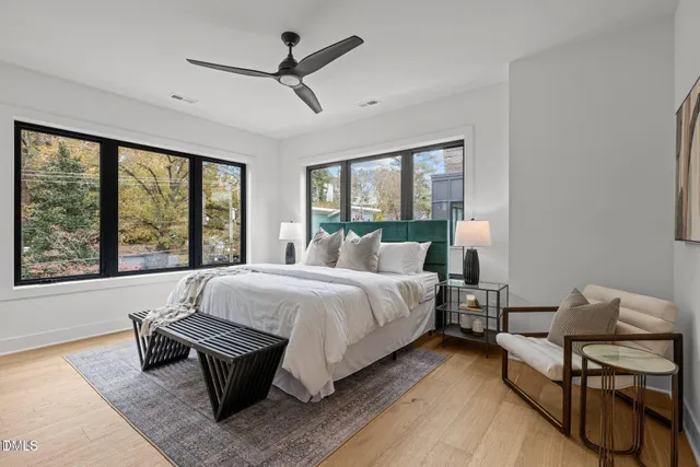 a bed room with a bed and a chair