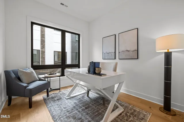 a view of a livingroom with furniture and window