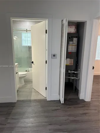 a view of a bathroom from the hallway