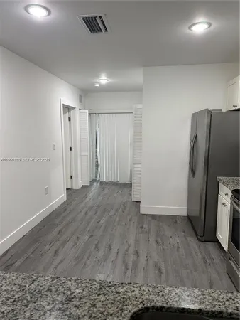 a view of a livingroom with wooden floor