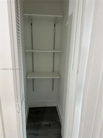 a view of an empty walk in closet