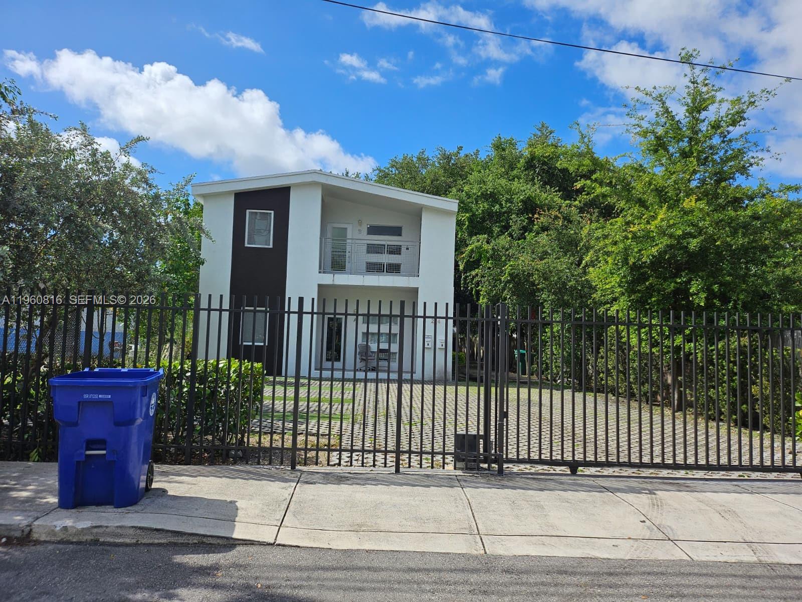 224 Northwest 57th Street, Unit B Miami, FL 33127 - Photo 31 of 40 a view of a house with a small garden