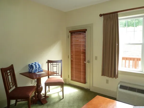 a workspace with furniture and a window