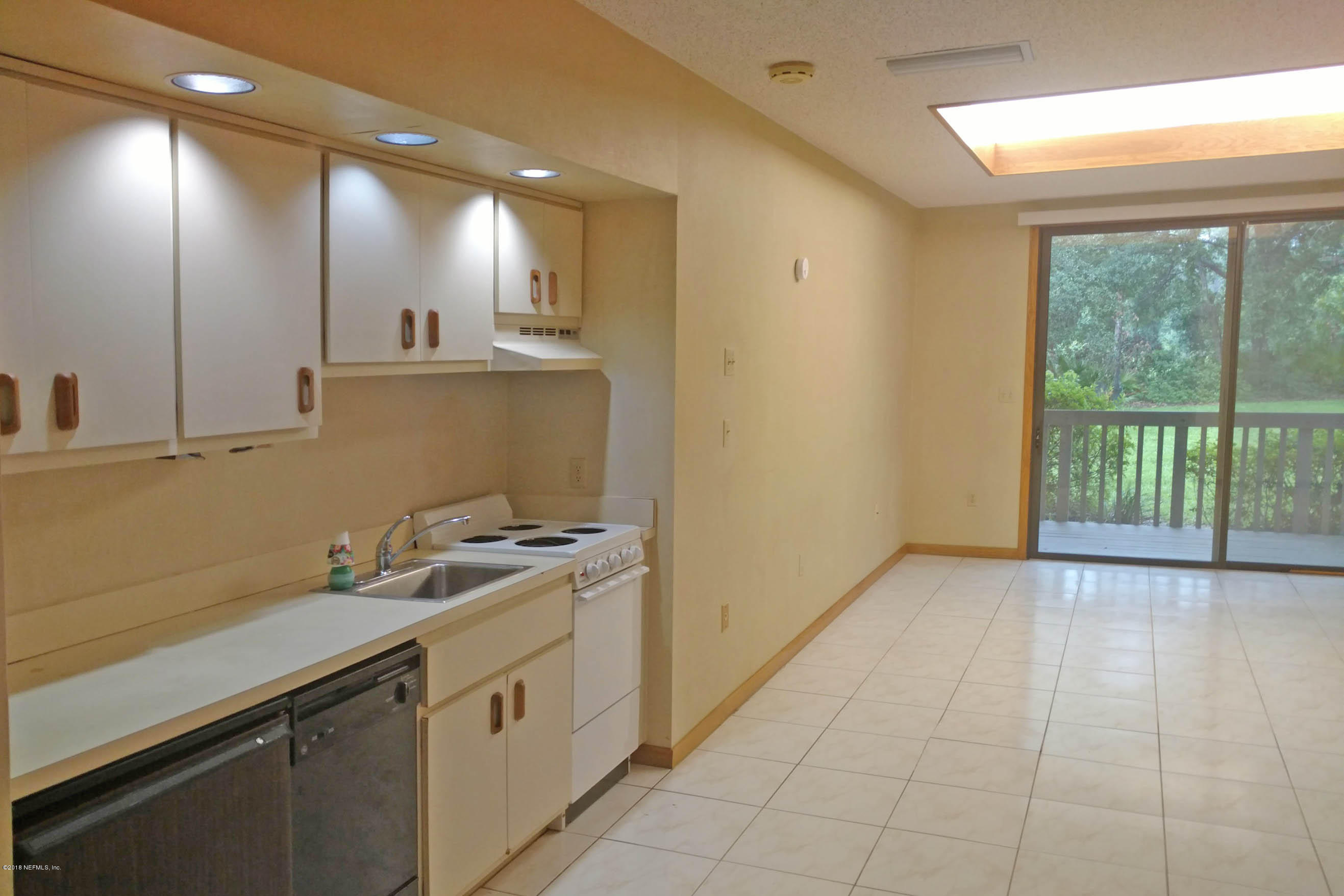3175 Ravines Road, Unit 3705 Middleburg, FL 32068 - Photo 3 of 13 a view of a kitchen with a sink and dishwasher next to a window