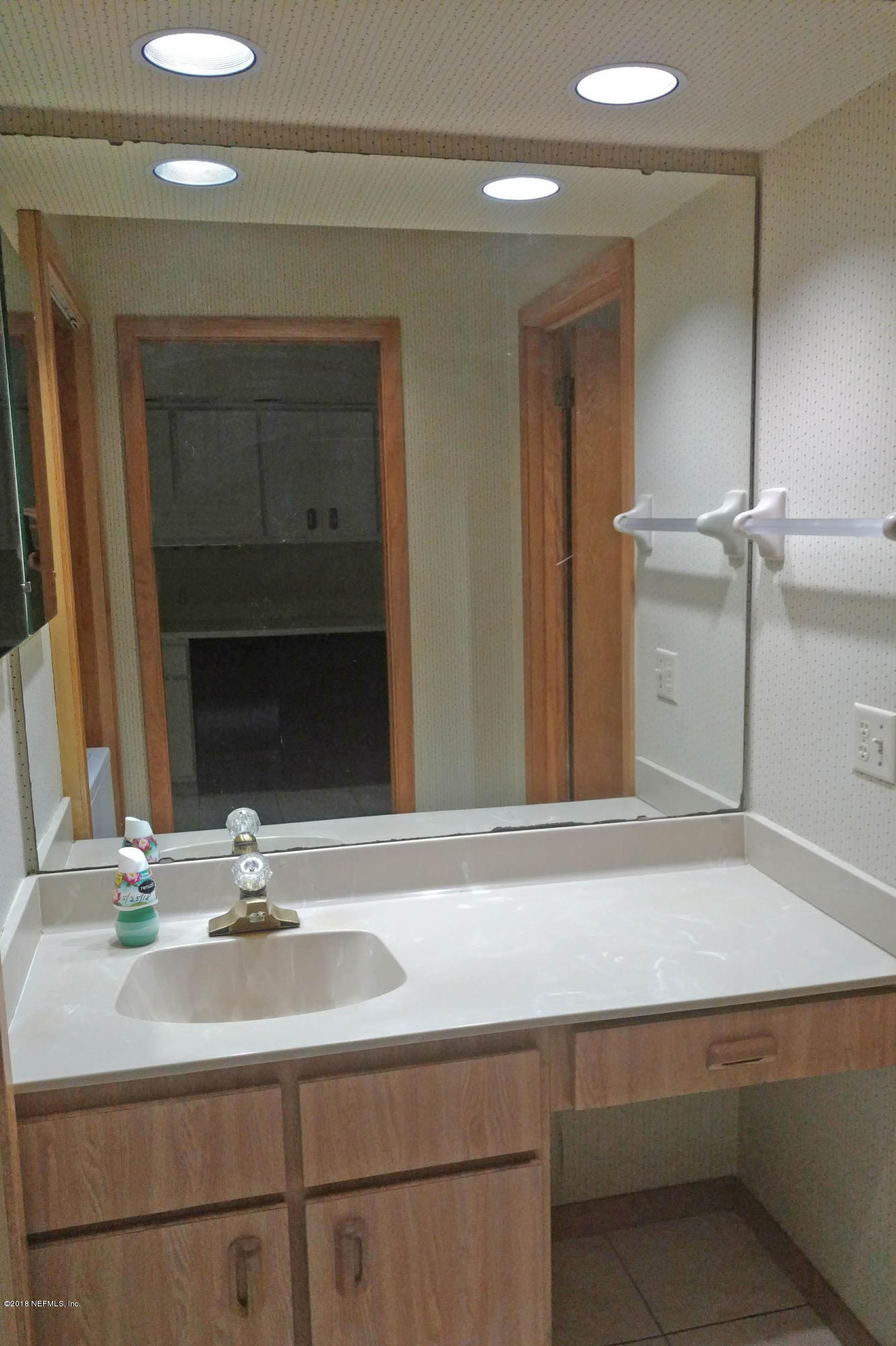 3175 Ravines Road, Unit 3705 Middleburg, FL 32068 - Photo 7 of 13 a bathroom with a sink and a mirror