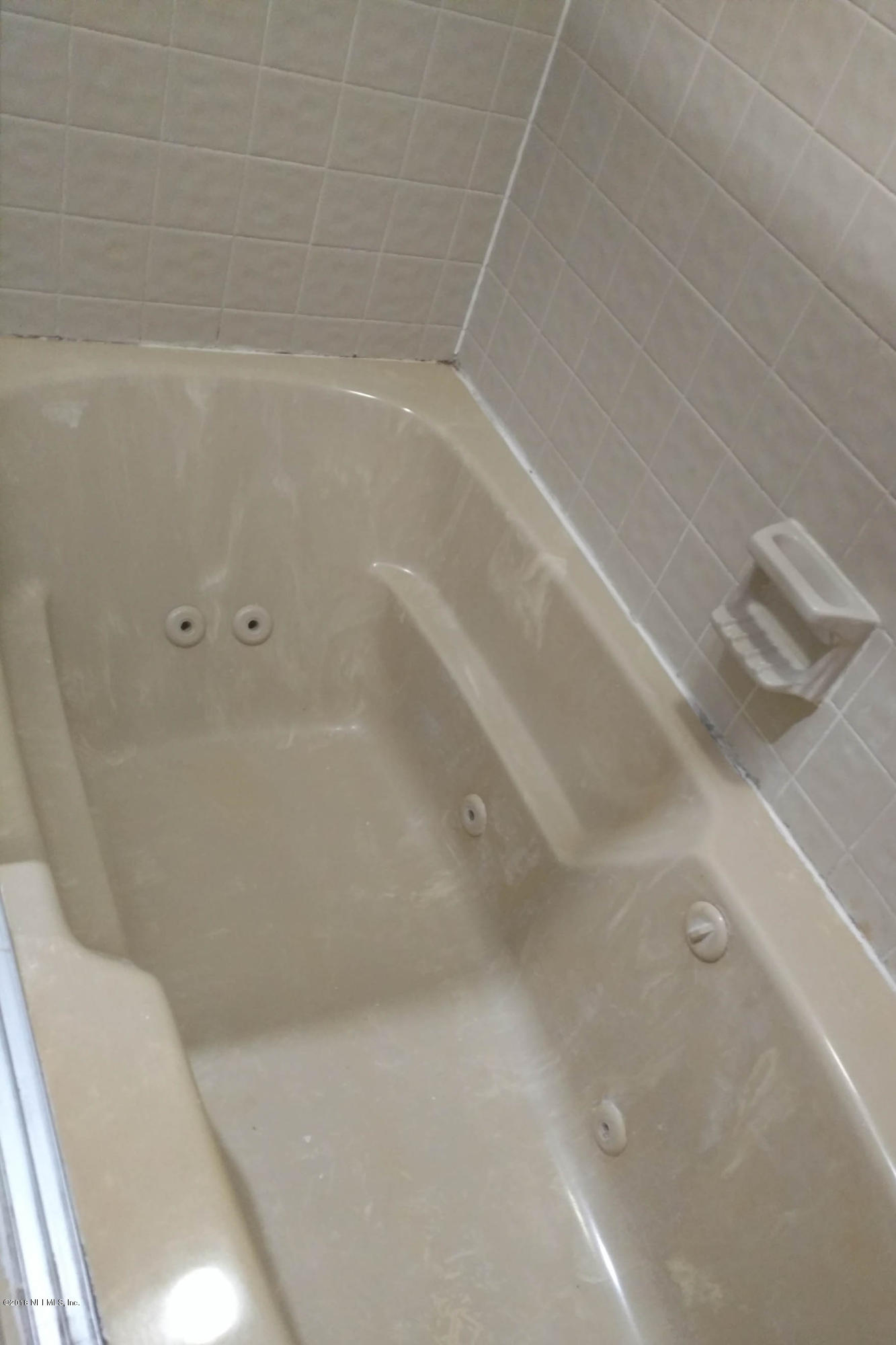 3175 Ravines Road, Unit 3705 Middleburg, FL 32068 - Photo 8 of 13 a view of a bathtub in a bathroom