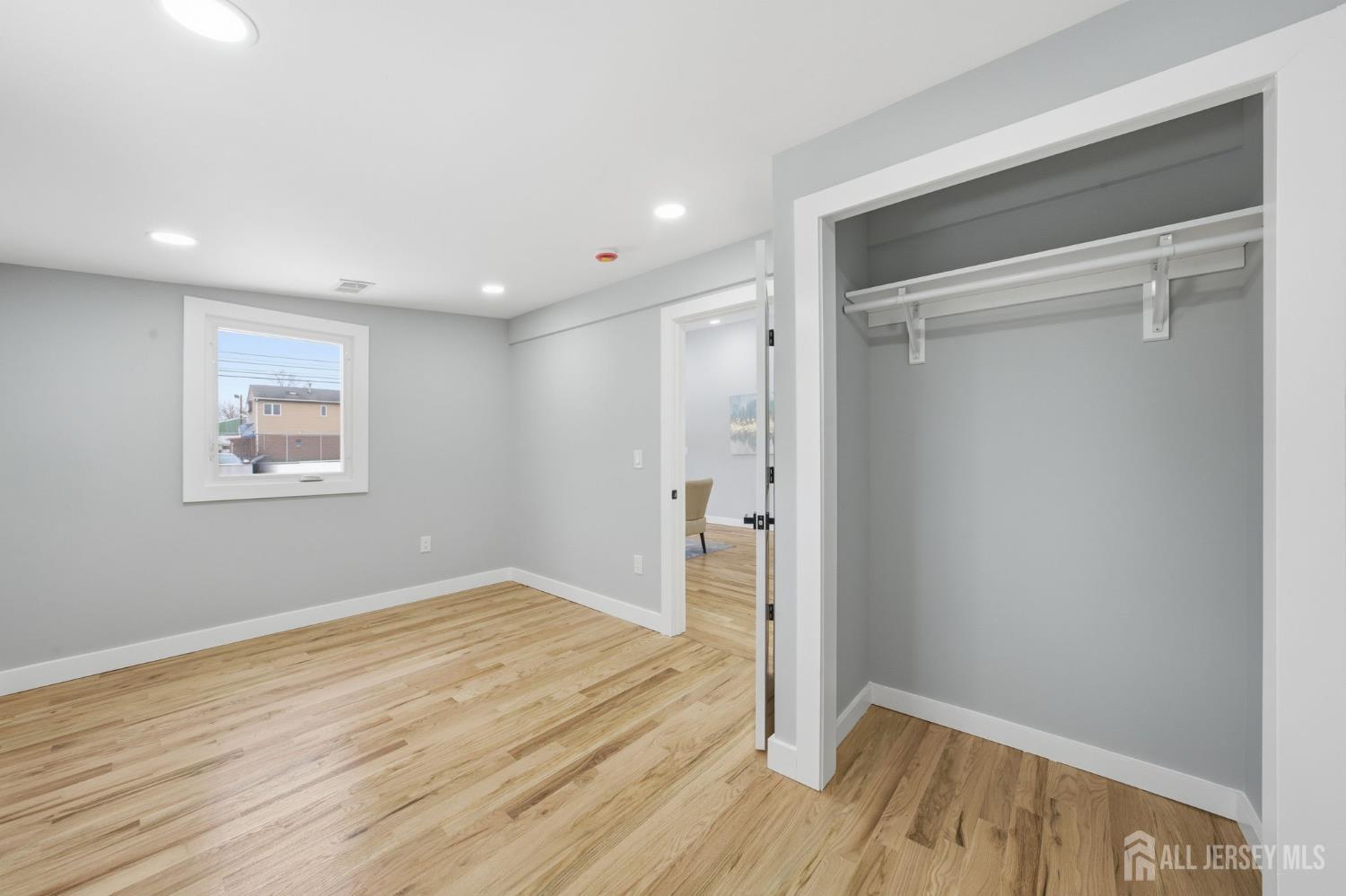 115 Frank Street Somerset, NJ 08873 - Photo 12 of 30 a view of empty room with wooden floor