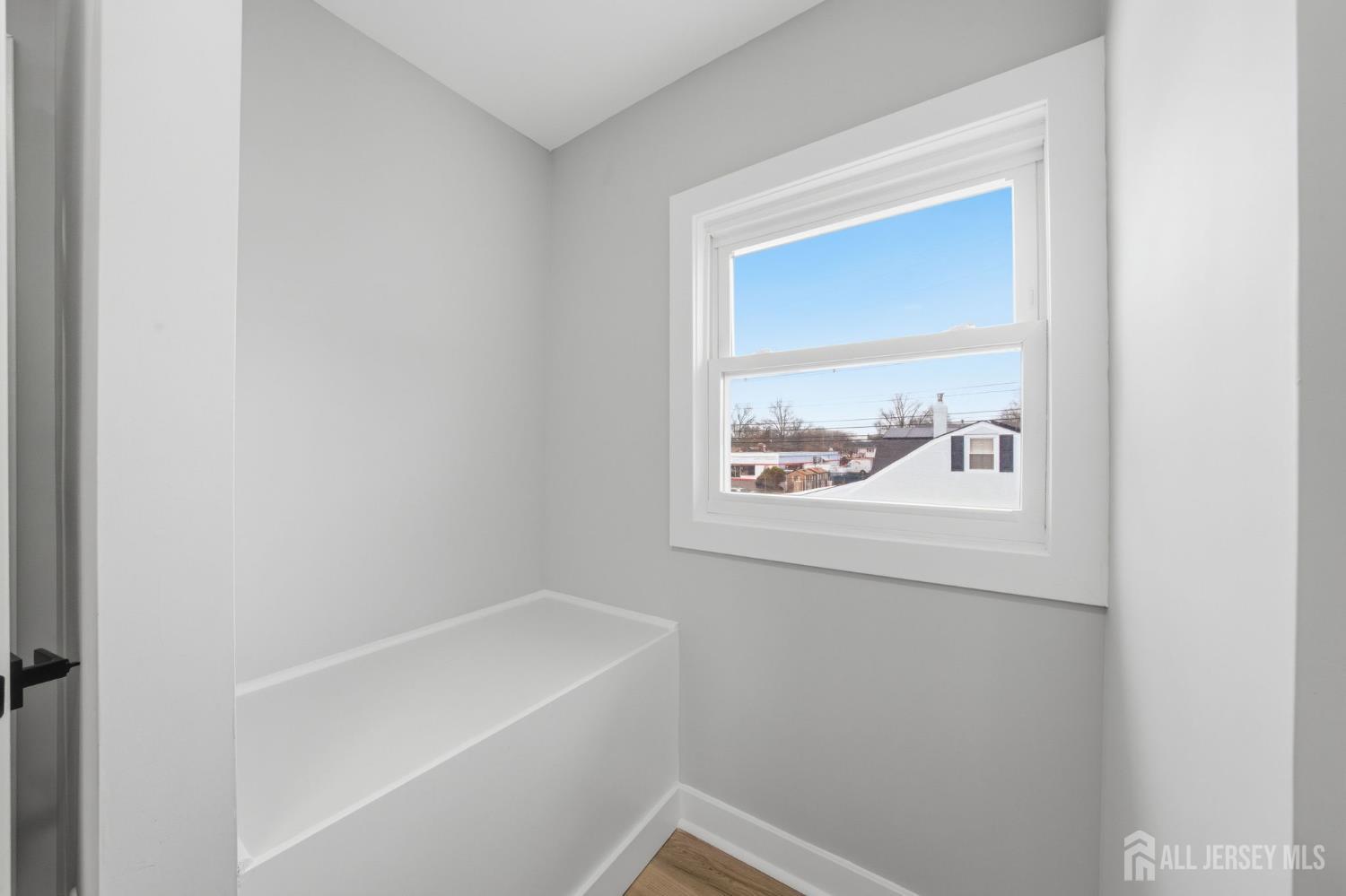 115 Frank Street Somerset, NJ 08873 - Photo 15 of 30 a bathroom with a bathtub and a window