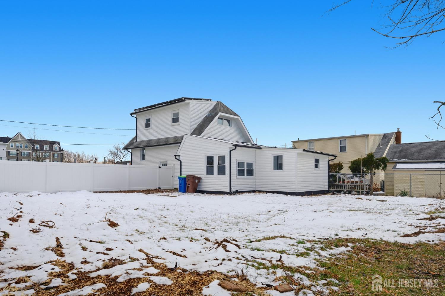 115 Frank Street Somerset, NJ 08873 - Photo 23 of 30 a view of a house with a snow in the yard