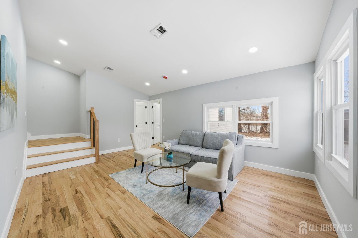 115 Frank Street Somerset, NJ 08873 - Photo 10 of 30 a living room with furniture and a wooden floor