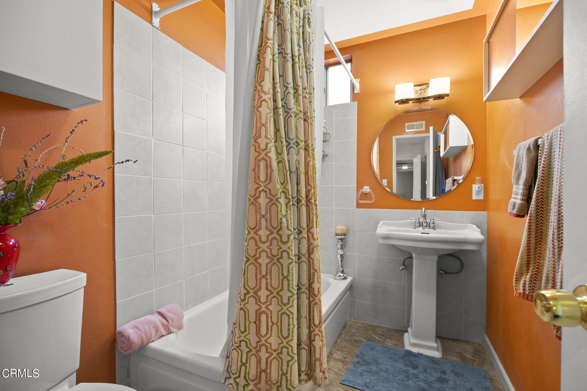 1402 Meadowbrook Road Ojai, CA 93023 - Photo 20 of 31 a bathroom with a sink and mirror with toilet