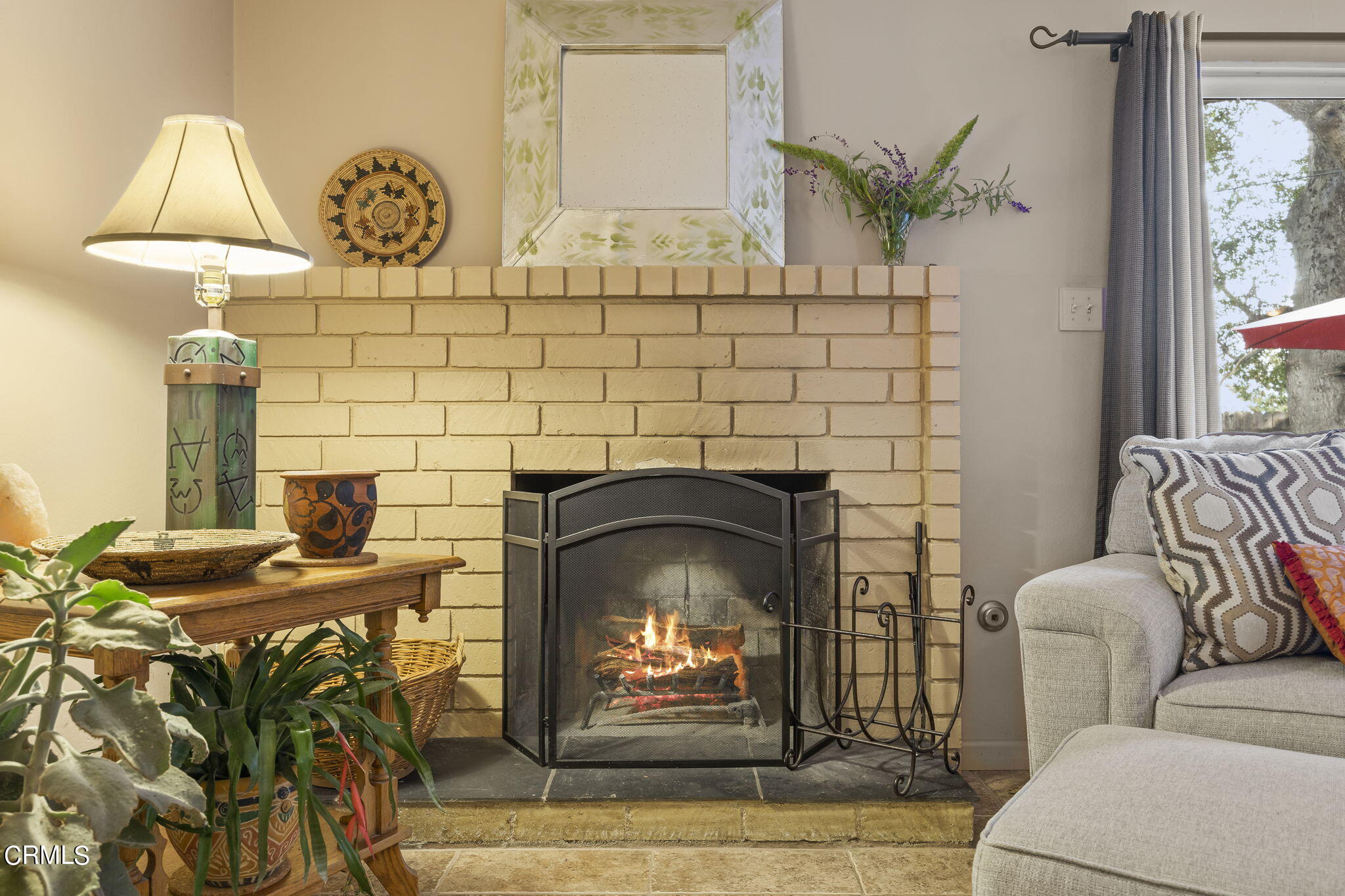 1402 Meadowbrook Road Ojai, CA 93023 - Photo 2 of 31 a living room with furniture and a fireplace