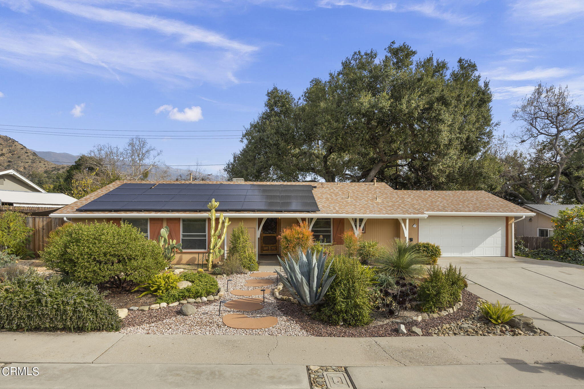 1402 Meadowbrook Road Ojai, CA 93023 - Photo 31 of 31 front view of a house with a garden