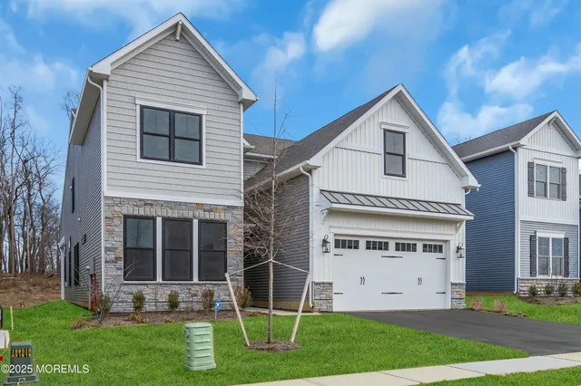 a view of house with yard