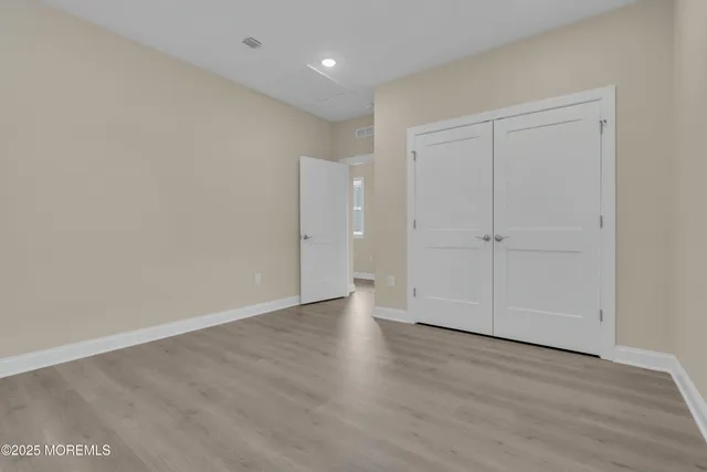 a view of empty room with white walls