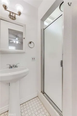 a view of a patio with table and chairs and potted plants