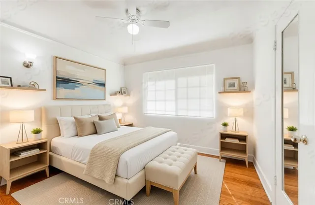 a bedroom with a bed and a lamp