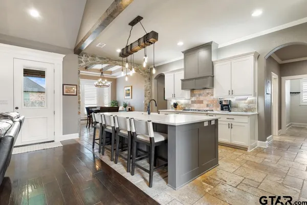 a bedroom with a bed and a lamp