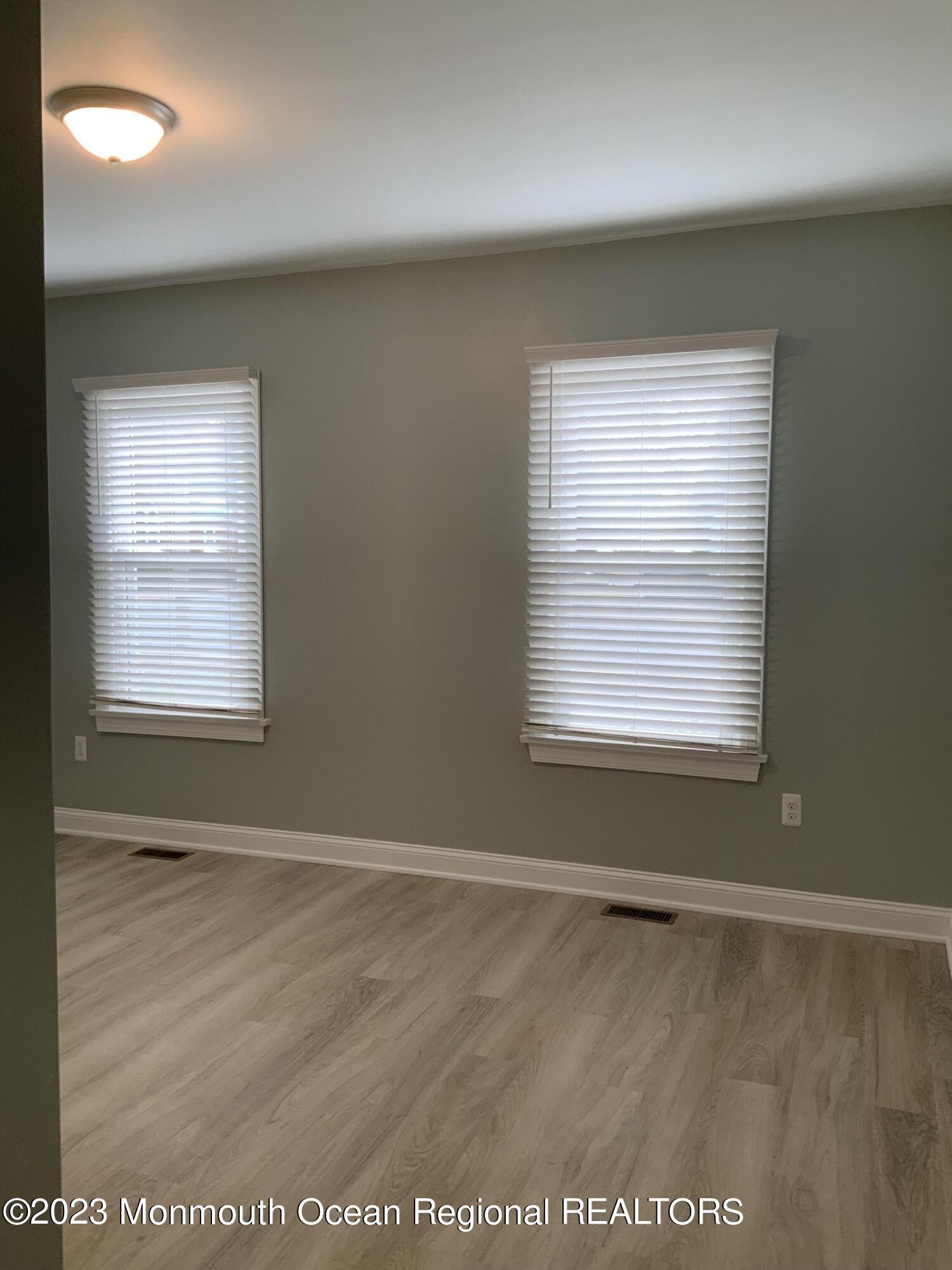 104 Bridge Avenue, Unit APARTMENT 1 Red Bank, NJ 07701 - Photo 14 of 25 an empty room with a window