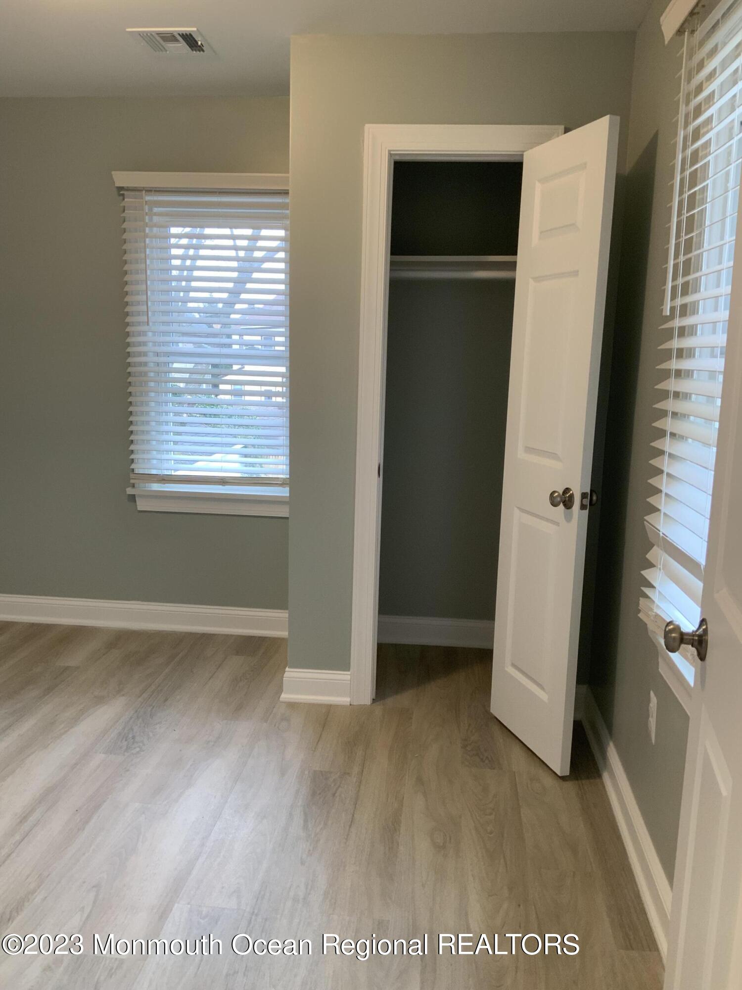 104 Bridge Avenue, Unit APARTMENT 1 Red Bank, NJ 07701 - Photo 24 of 25 an entryway with wooden floor and a window
