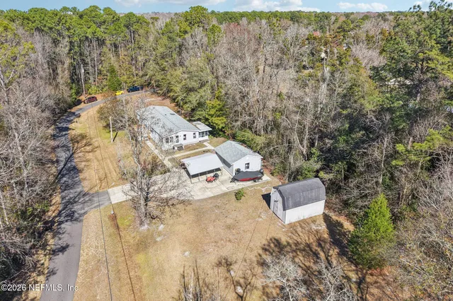an aerial view of residential house with outdoor space