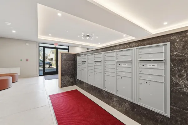 a view of walk in closet with clothes