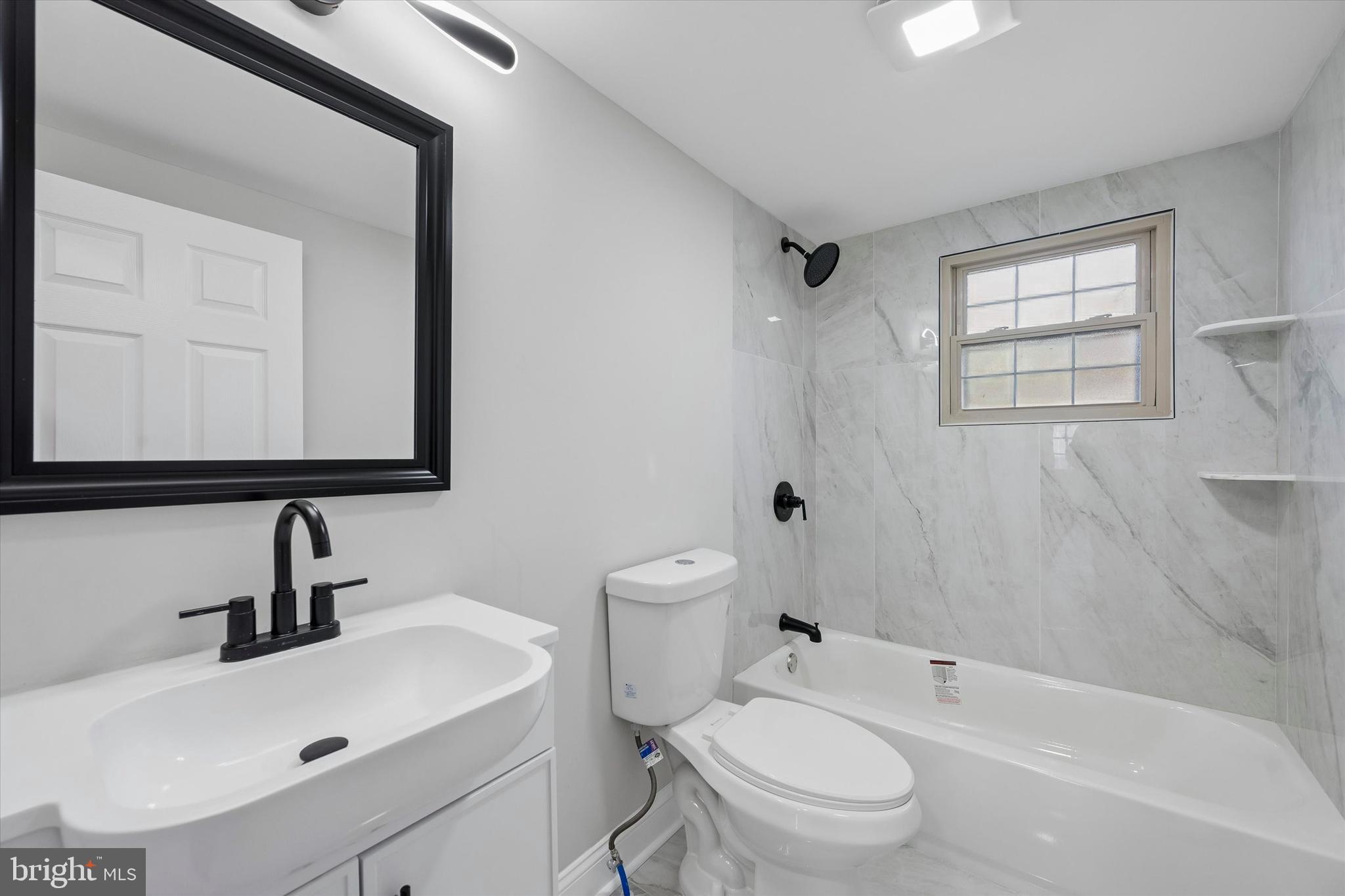 635 Stanton Christiana Road Newark, DE 19713 - Photo 6 of 12 a bathroom with a sink toilet vanity and shower