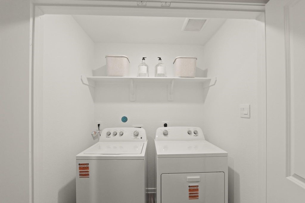 24114 Chirp Street Splendora, TX 77372 - Photo 15 of 22 a utility room with dryer and washer