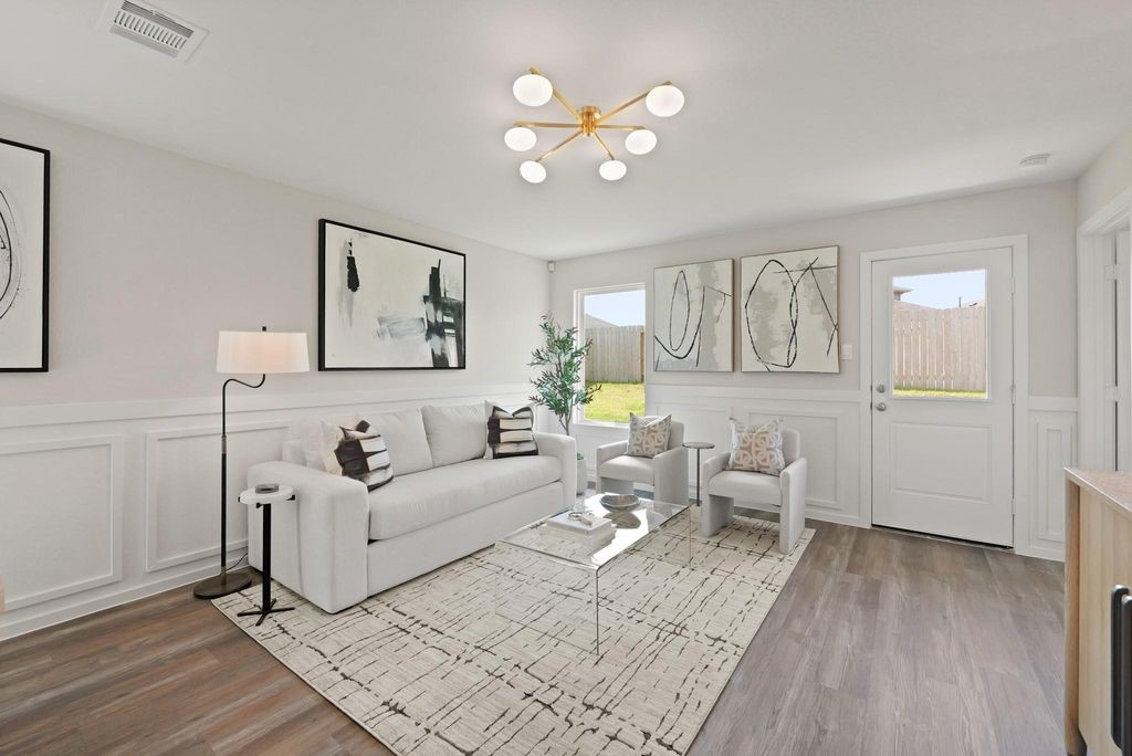 24114 Chirp Street Splendora, TX 77372 - Photo 8 of 22 a living room with furniture and wooden floor