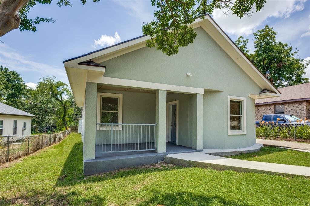 618 East Woodard Street Denison, TX 75021 - Photo 1 of 22 a front view of a house with a yard