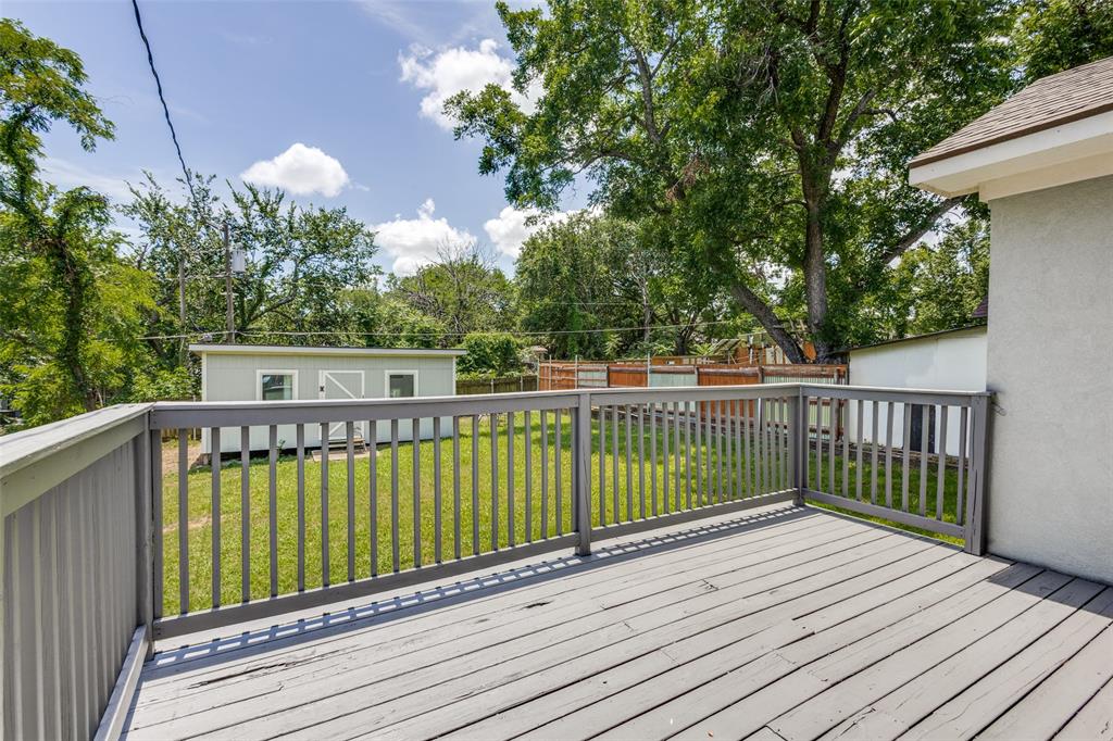 618 East Woodard Street Denison, TX 75021 - Photo 19 of 22 a view of a wooden deck