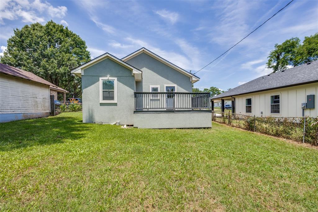 618 East Woodard Street Denison, TX 75021 - Photo 20 of 22 a view of a house with backyard and garden