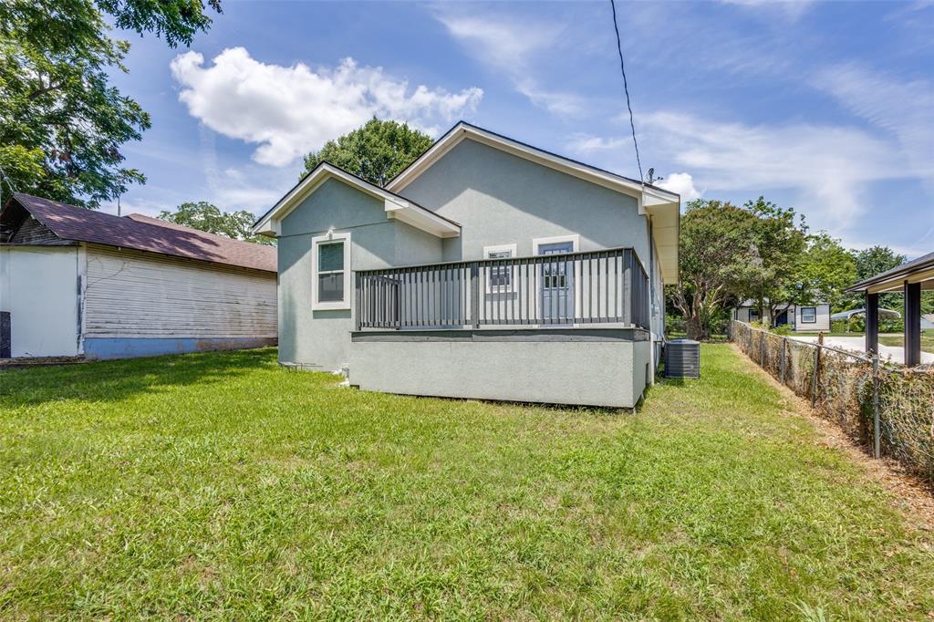 618 East Woodard Street Denison, TX 75021 - Photo 21 of 22 a view of a house with a yard and a garden