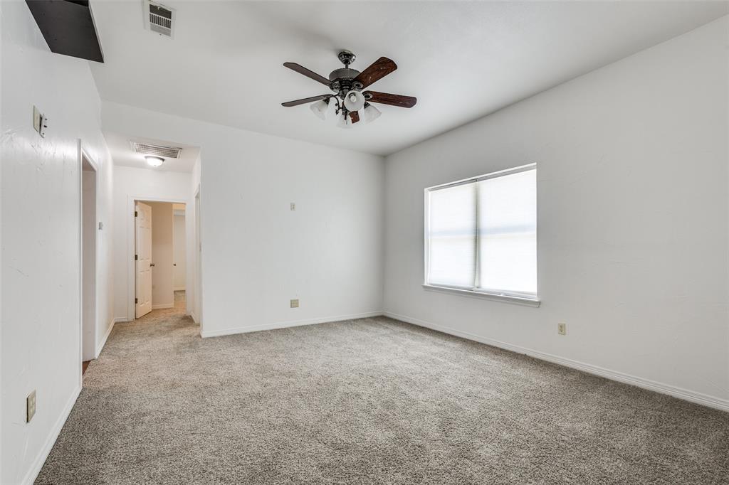 618 East Woodard Street Denison, TX 75021 - Photo 5 of 22 an empty room with fan and windows