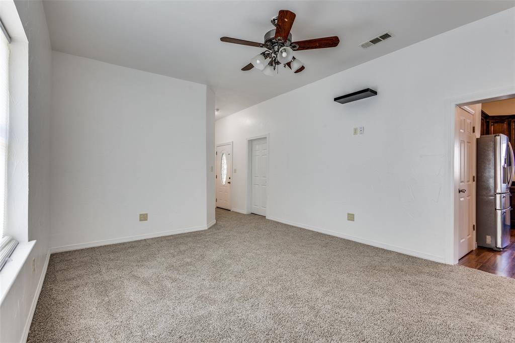 618 East Woodard Street Denison, TX 75021 - Photo 7 of 22 a view of room with hardwood floor