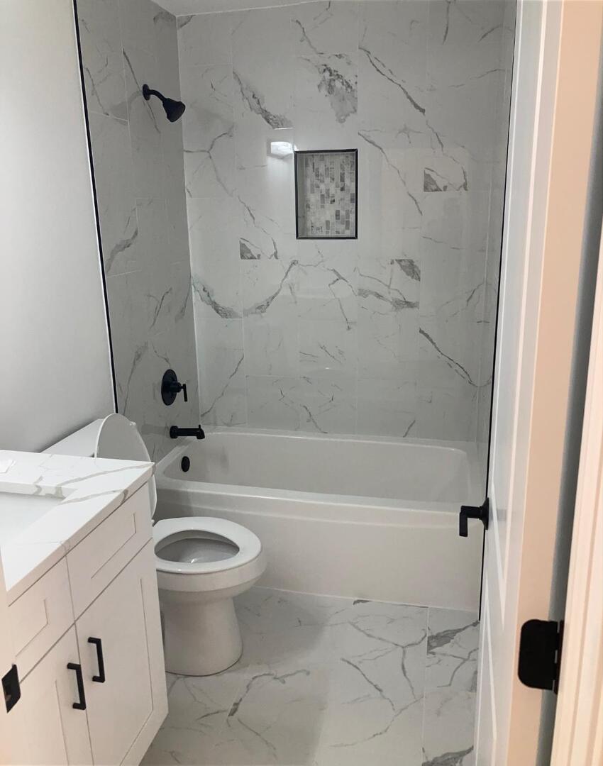 935 Saddle Ridge Drive Joliet, IL 60432 - Photo 12 of 21 a bathroom with a granite countertop sink toilet and shower