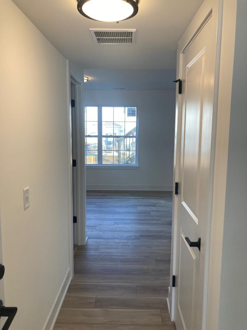 935 Saddle Ridge Drive Joliet, IL 60432 - Photo 15 of 21 a view of an empty room with wooden floor and a window