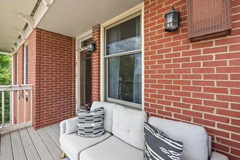 a view of a balcony with chairs