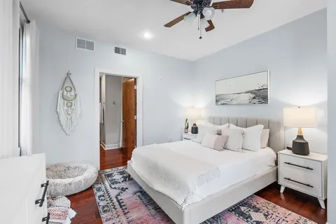 a bedroom with a bed and a table in it