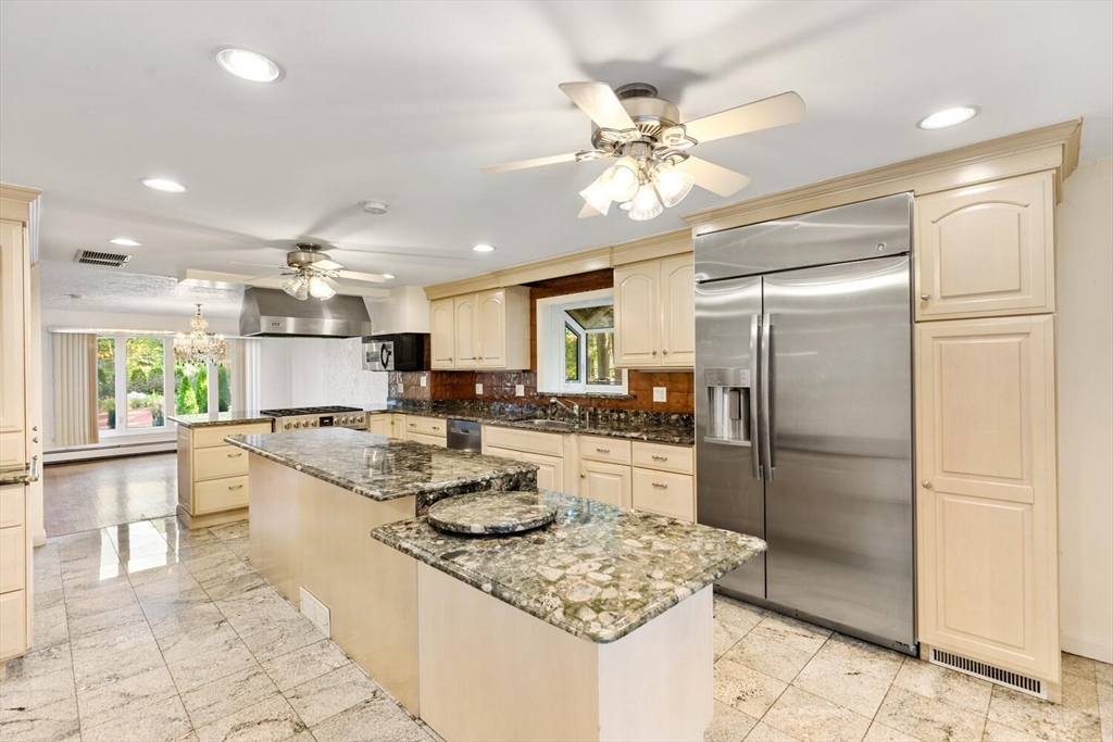 227 Walnut Street Saugus, MA 01906 - Photo 14 of 41 a kitchen with refrigerator and cabinets