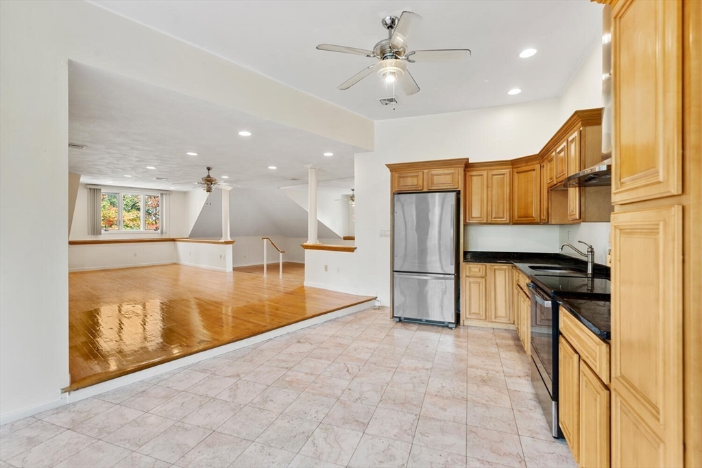 227 Walnut Street Saugus, MA 01906 - Photo 22 of 41 a view of a kitchen with a stove top oven a sink and a refrigerator