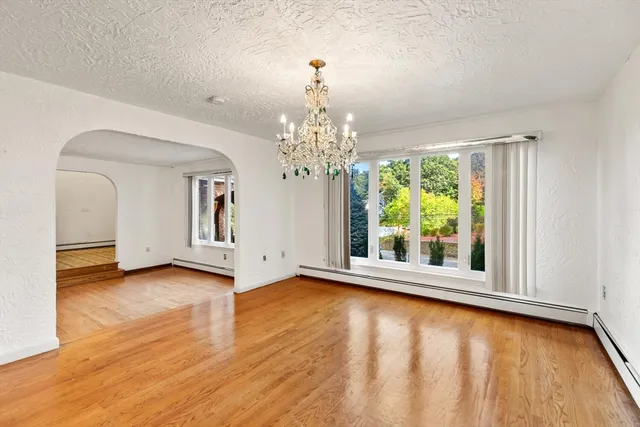 a view of a room with window wooden floor and windows