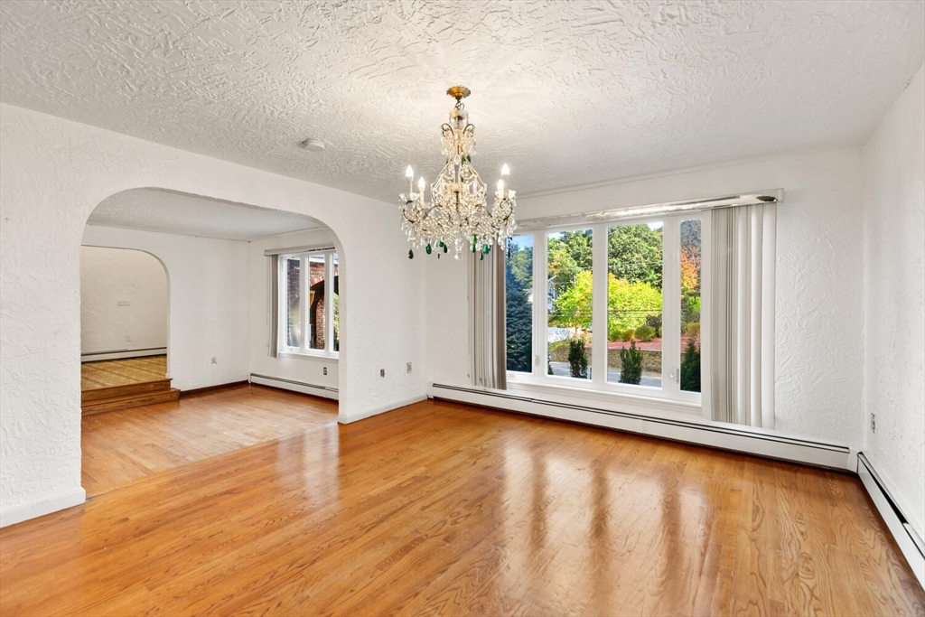 227 Walnut Street Saugus, MA 01906 - Photo 9 of 41 a view of a room with window wooden floor and windows