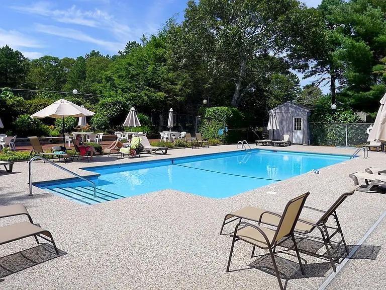 15 Riverview Avenue, Unit D Mashpee, MA 02649 - Photo 27 of 33 a swimming pool with outdoor seating and yard