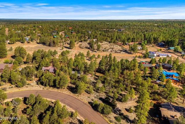 an aerial view of residential building with parking space
