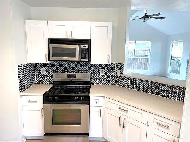 4410 Sojourner Street Austin, TX 78724 - Photo 5 of 15 a kitchen with granite countertop cabinets stove top oven and sink