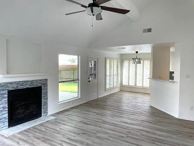 4410 Sojourner Street Austin, TX 78724 - Photo 7 of 15 a view of an empty room with a fireplace and a window